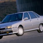 Silver classic car parked up