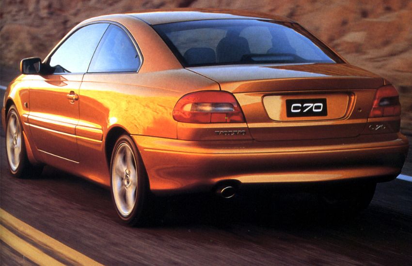 Rear view of an orange car in motion