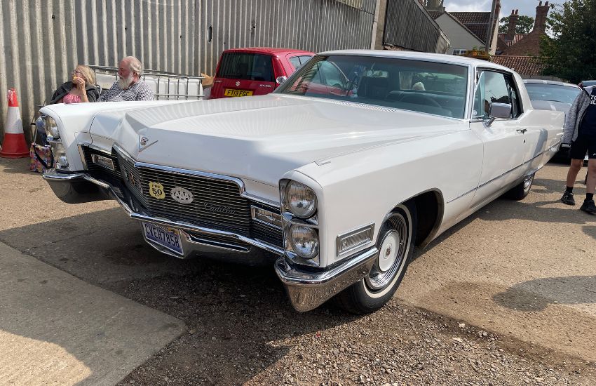 White 1968 Cadillac DeVille classic American muscle car parked up at an event