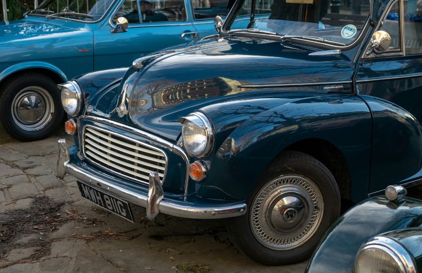 Row of collectible classic cars parked together, perfect scenario for multi-car insurance.