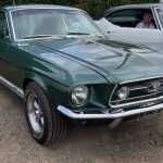 Metallic green 1967 Ford Mustang Fastback classic American muscle car parked up