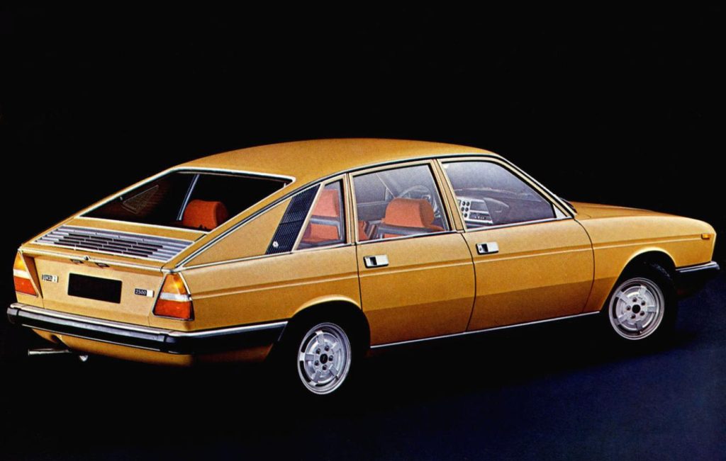 Rear side view of a yellow classic car