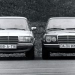 Two Mercedes W123 classic cars parked side by side