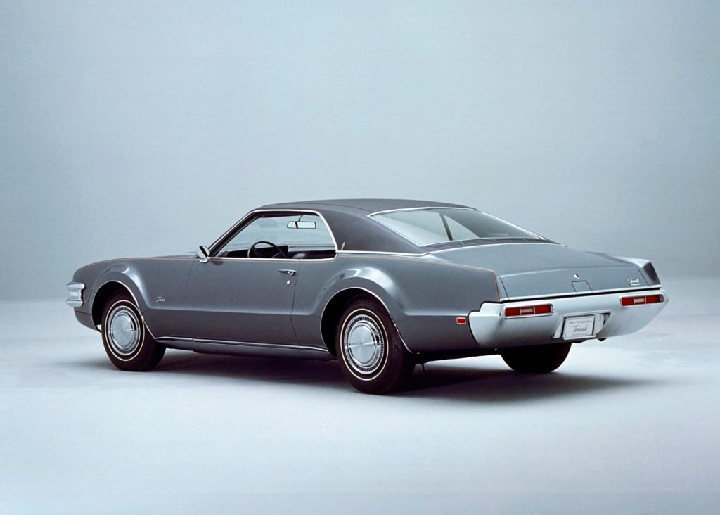 Back of grey Oldmobile Toronado