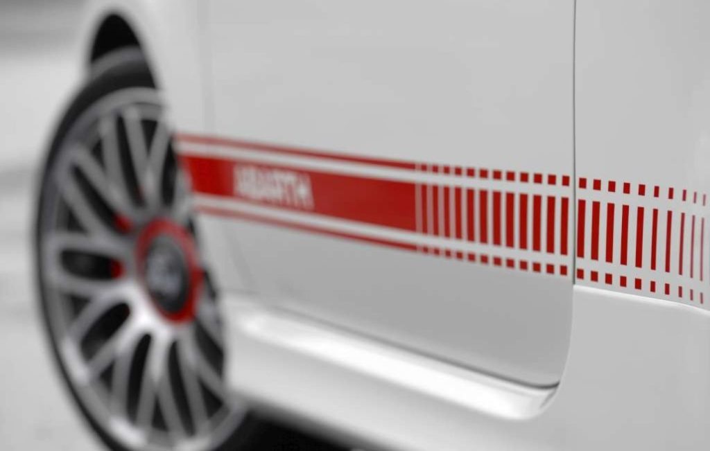 Red side stripes with "ABARTH" lettering on a white car