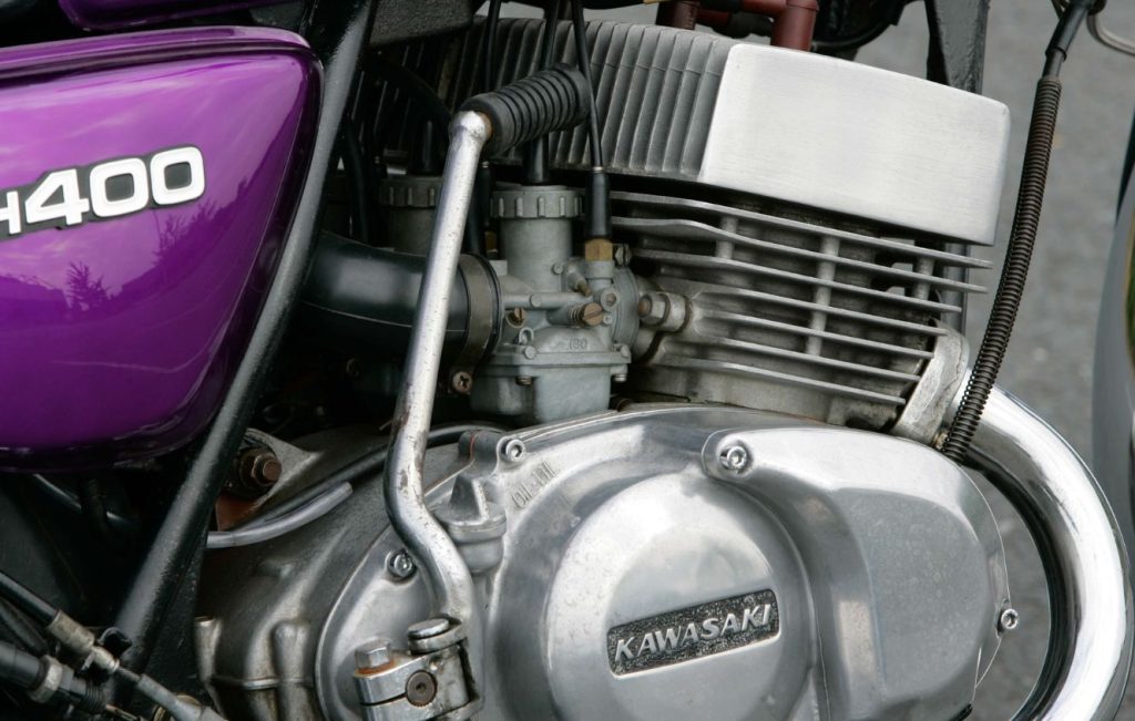 Air-cooled, three-cylinder, two-stroke engine of a Kawasaki motorcycle