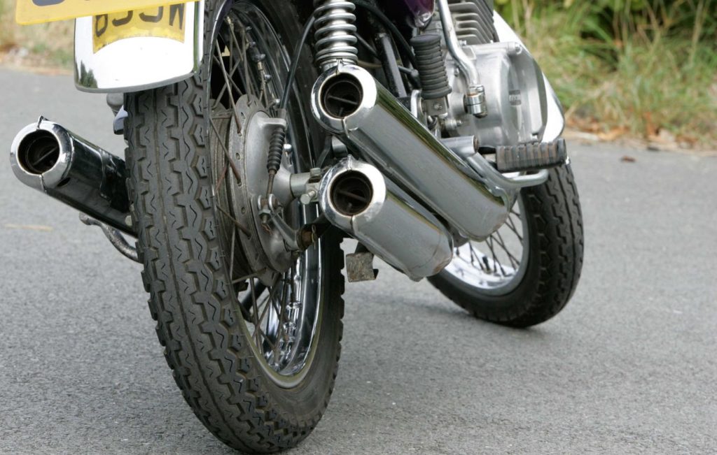 Exhaust pipe and rear wheel of a motorbike