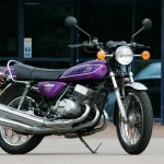 Metallic purple classic motorbike parked up