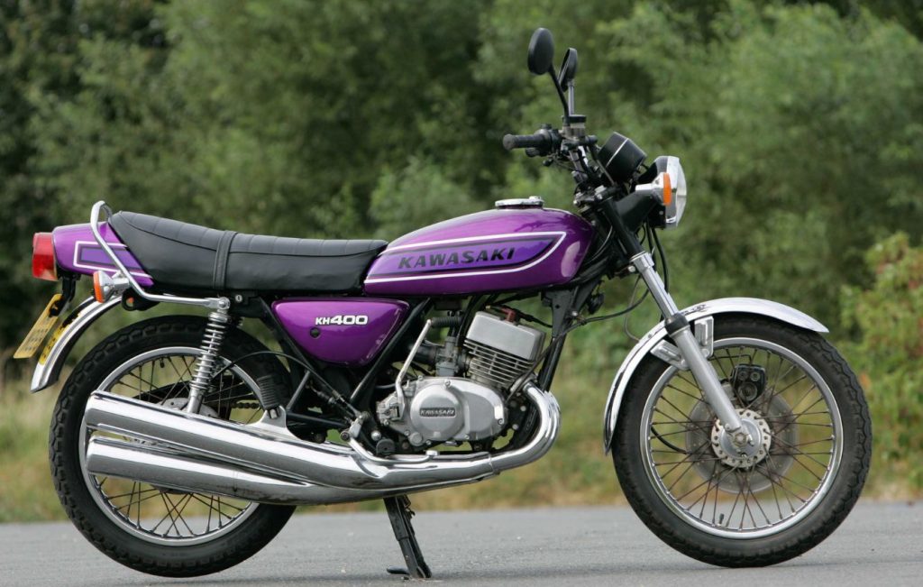 Metallic purple classic motorbike parked up