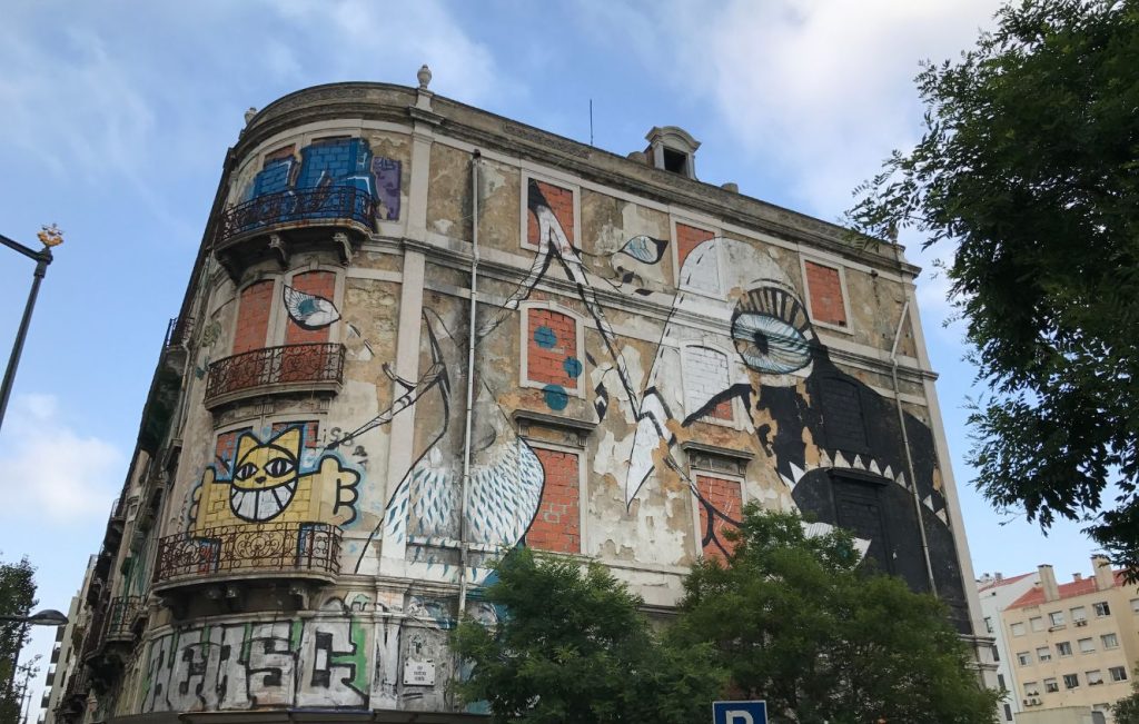 A cluster of derelict, four-story buildings on Avenida Fontes Pereira de Melo in Lisbon, Portugal