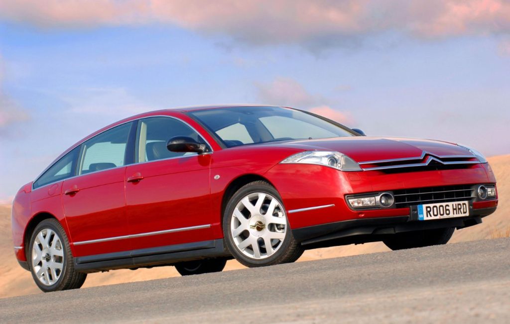 Metallic red Citroen C6 parked up