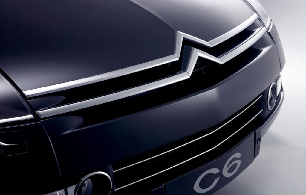 Close up of the front grill on a dark blue car