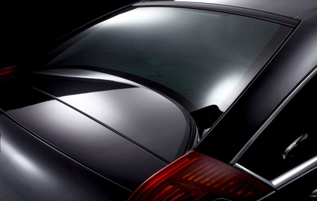 Concave rear window of a black car