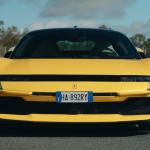 Front view of a parked yellow Ferrari 849