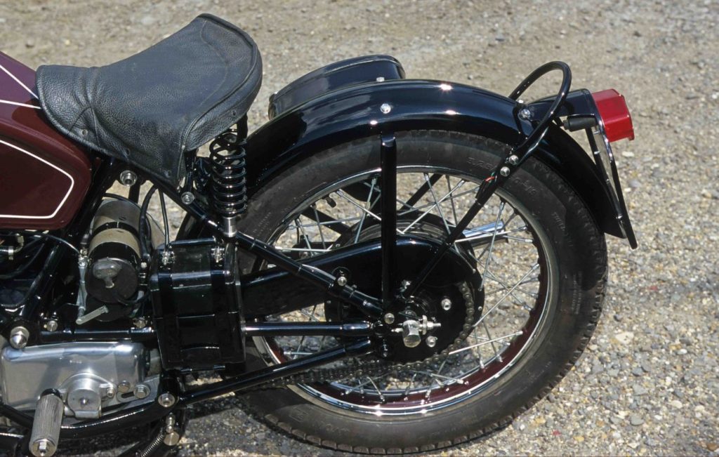 Rear wheel and leather seat of a classic motorcycle