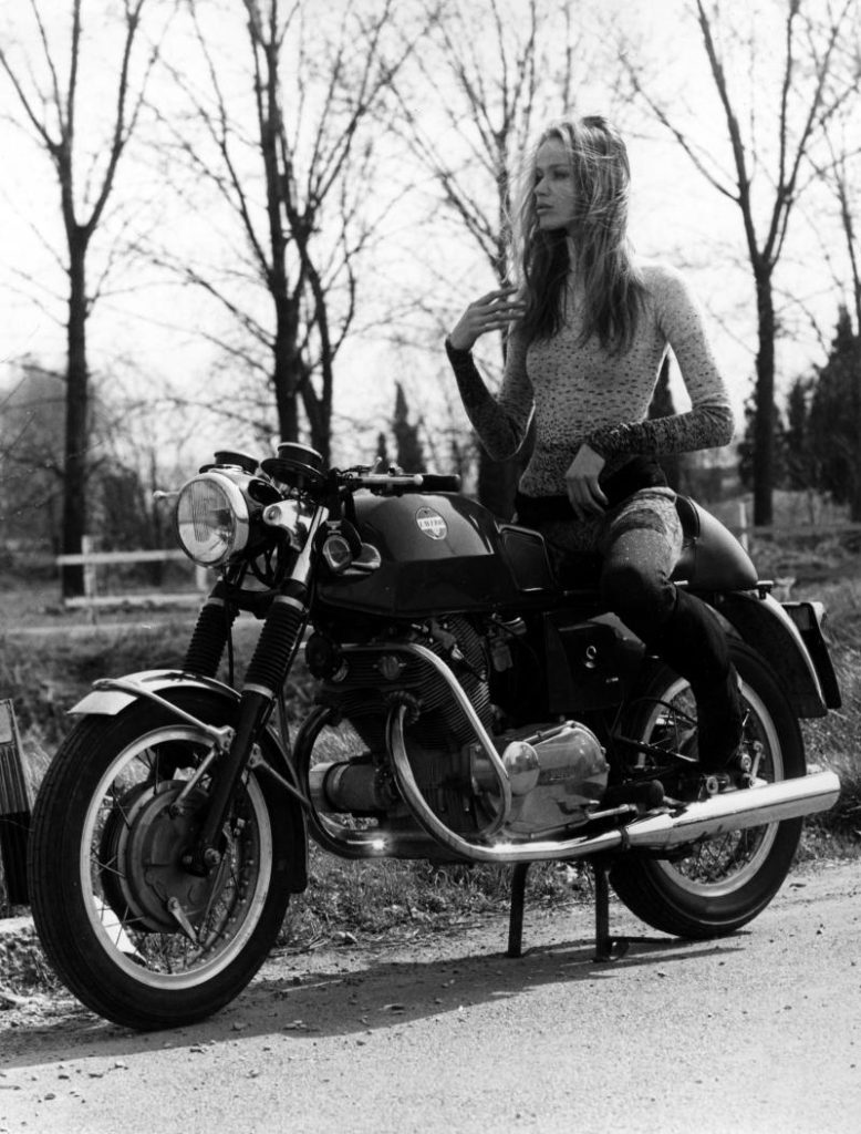 Woman sat on a classic Laverda 750S motorbike