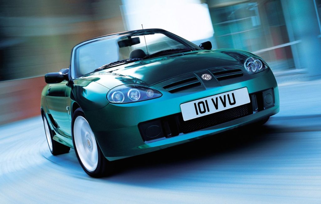 Metallic green MG TF classic car in motion