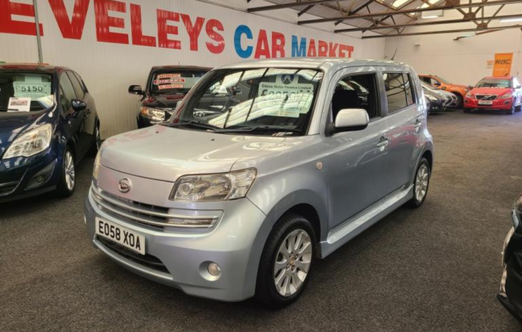 Silver Daihatsu Materia parked in a car showroom