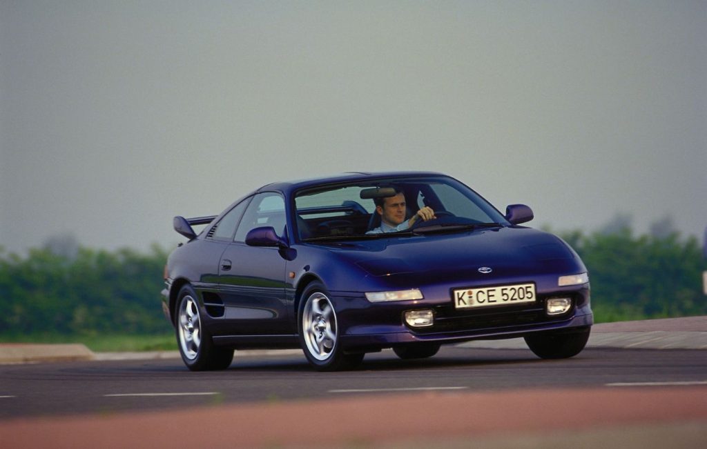 Man driving a blue Toyota MR2 MK2