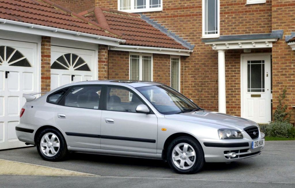Silver Hyundai Elantra parked on the driveway of a house