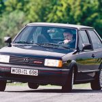 Man driving a black Volkswagen Polo G40