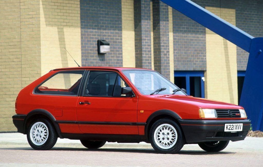 Side view of a parked red Volkswagen Polo G40