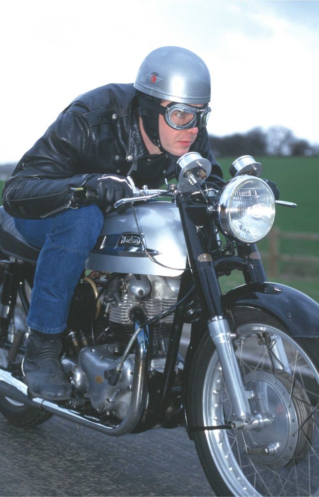 Man riding Norton Dominator 88 motorcycle