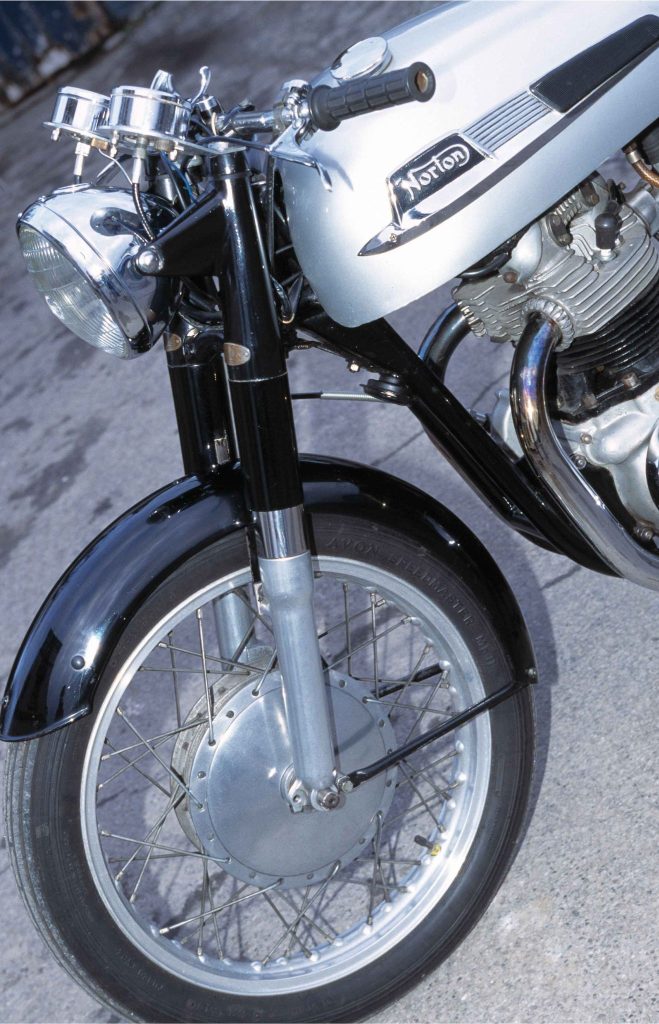 Norton Dominator 88 fuel tank and badges in classic black finish, iconic vintage British motorcycle livery
