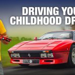 Henry Catchpole holding a model car next to a red Ferrari GTO