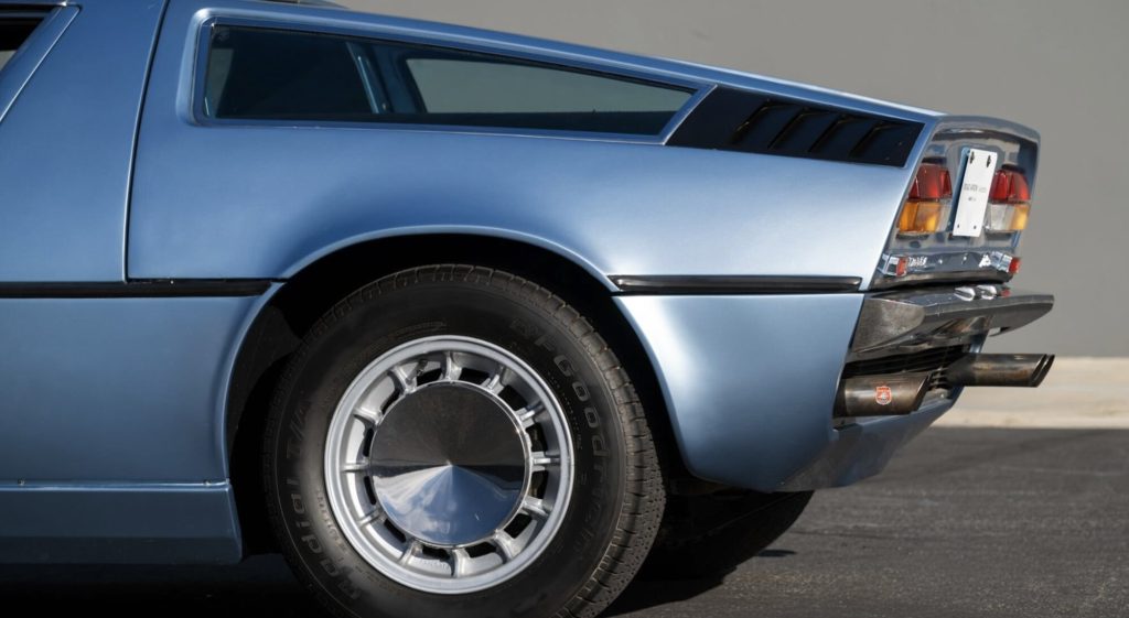 Rear three-quarter view of a light blue Maserati Bora