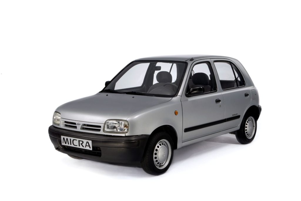 Silver Nissan Micra K11 five-door hatchback on a white studio background, front three-quarter view