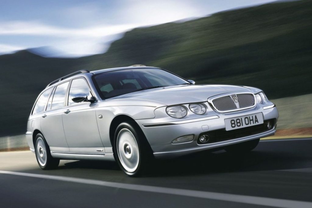 Silver Rover 75 Tourer estate being driven on a road with blurred green hills in the background