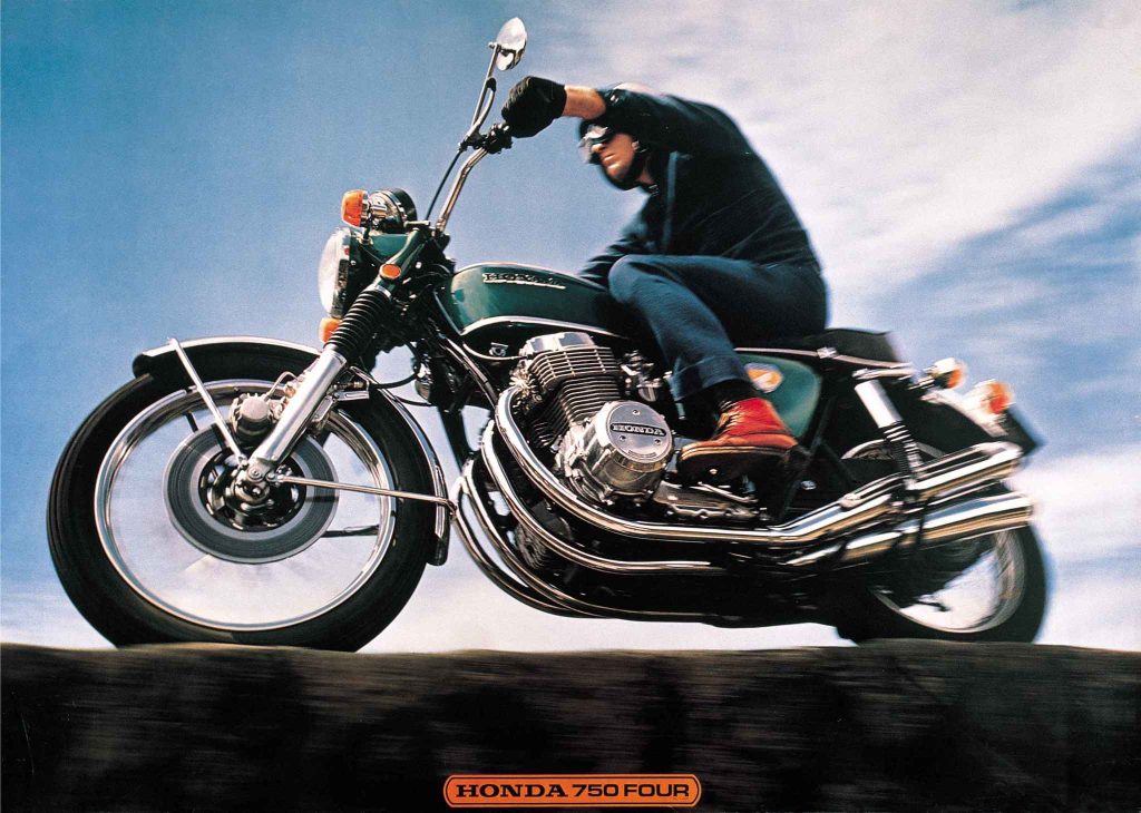 Honda CB750 Four brochure image showing a rider in black leaning the green four-cylinder machine against a dramatic sky backdrop, with Honda 750 Four logo
