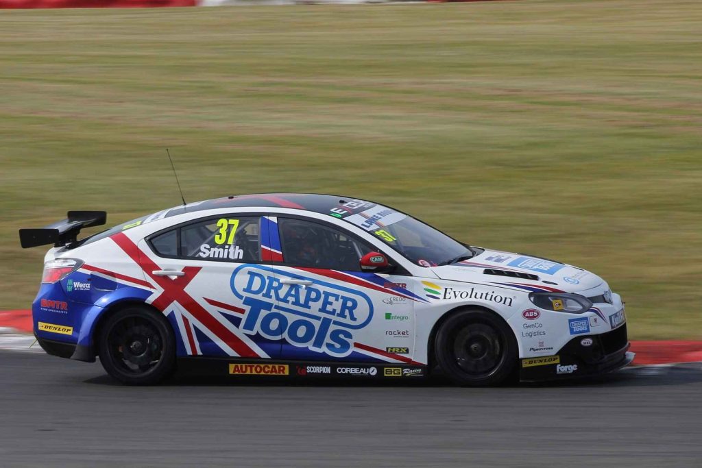 An MG6 BTCC race car (#37, driven by Smith) in Draper Tools livery featuring a Union Jack design in red, white, and blue, photographed on track at a racing circuit.
