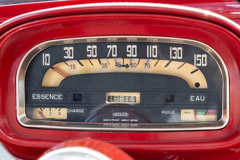 Close-up of the Jaeger instrument cluster on a Renault Floride, showing the arc-style speedometer reading up to 150 km/h, odometer reading 16,814 km, and warning gauges labelled Essence, Charge, Huile, and Eau.
