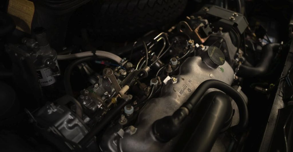 Close-up of the Citroën CX diesel engine bay showing the inline four-cylinder diesel engine with injection pump and inlet manifold