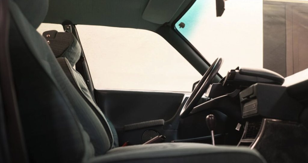 Interior view of a Citroën CX looking across the front seats toward the driver's side