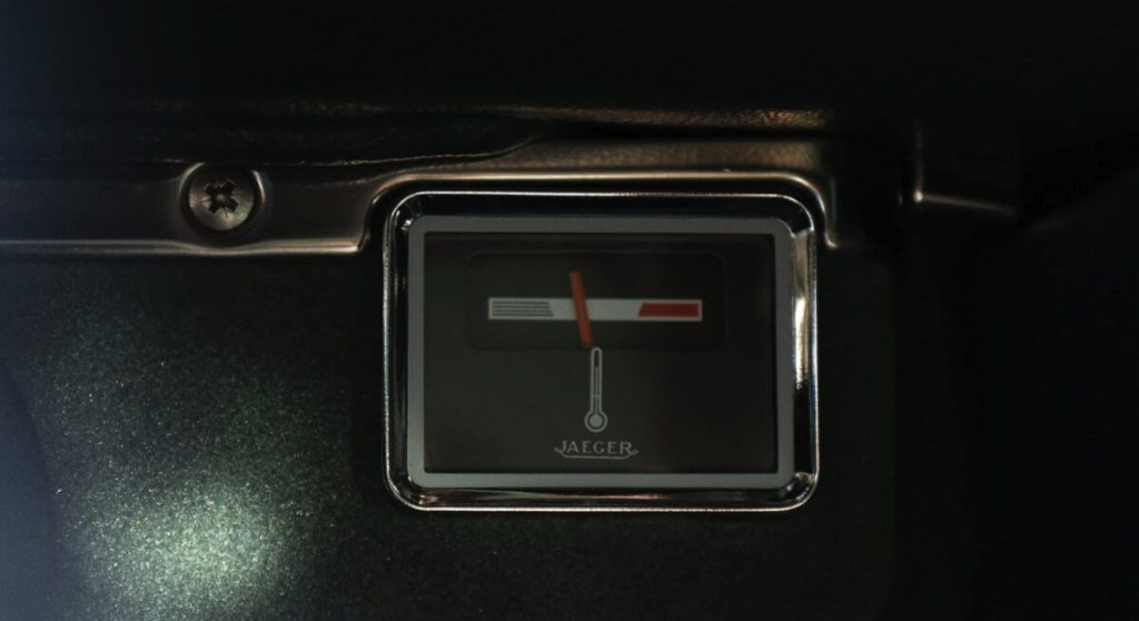 Close-up of a Jaeger temperature gauge set into a dark dashboard panel