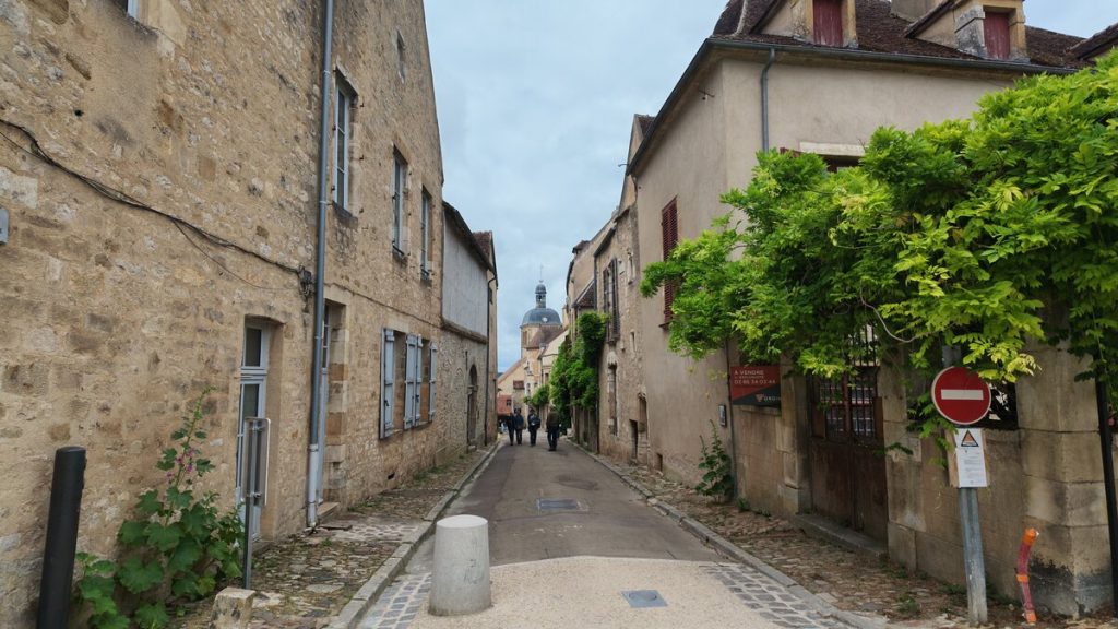 Narrow medieval cobblestone street in a Burgundy village