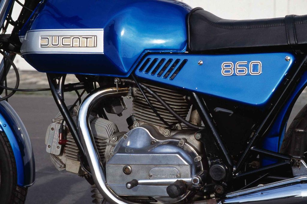 Ducati 860 bevel-drive V-twin engine with finned cylinders, chrome exhaust and tank badge
