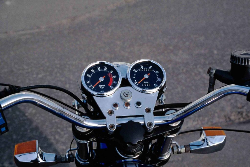Handlebars and twin instrument gauges on a vintage Ducati 860 motorcycle