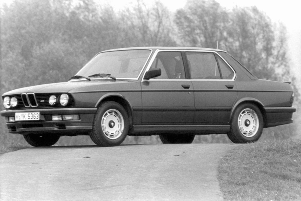 Black and white period press photograph of a BMW M535i E12 five-series four-door saloon
