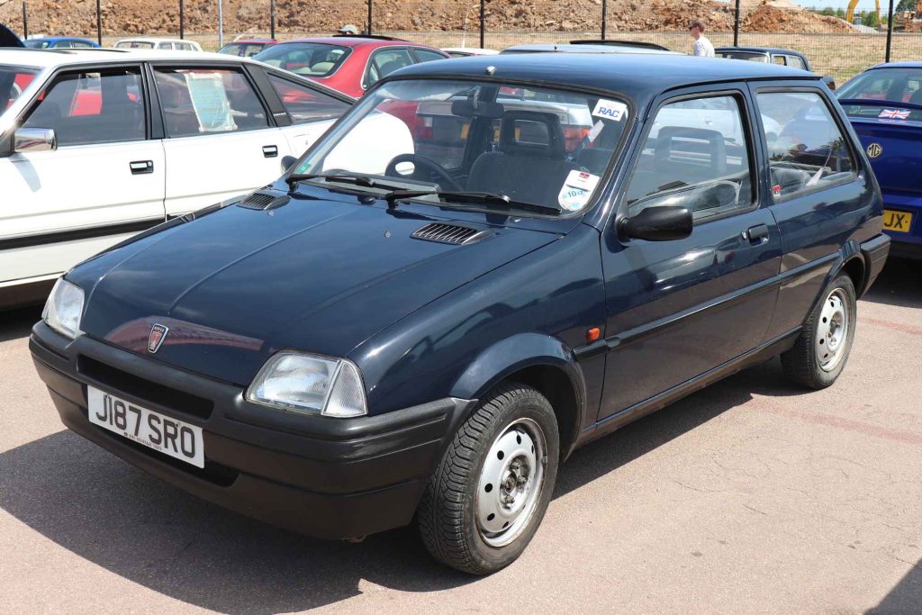 Front three-quarter view of a dark navy blue Rover Metro three-door hatchback parked