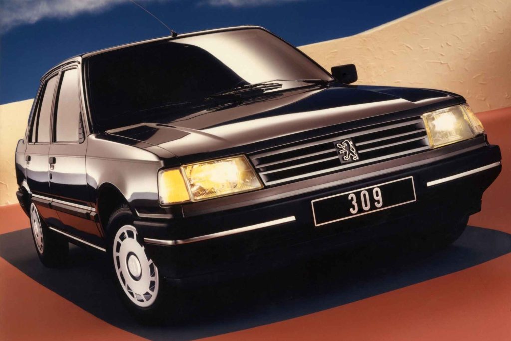 Peugeot 309 five-door in black, low front three-quarter press studio shot