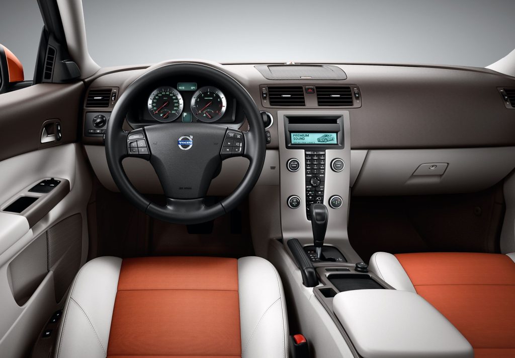 Volvo C30 interior with orange and cream leather seats, brown dashboard and floating center stack