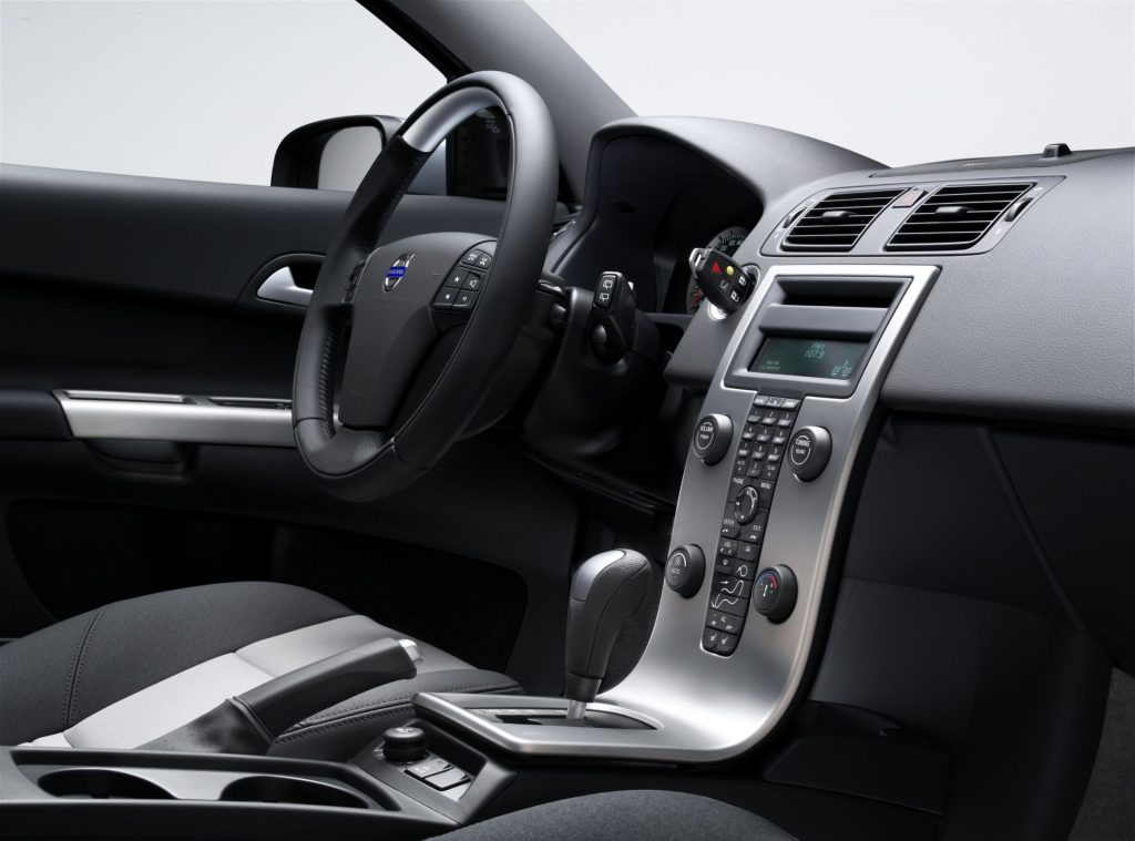 Volvo C30 black interior with brushed aluminum center console and sport steering wheel