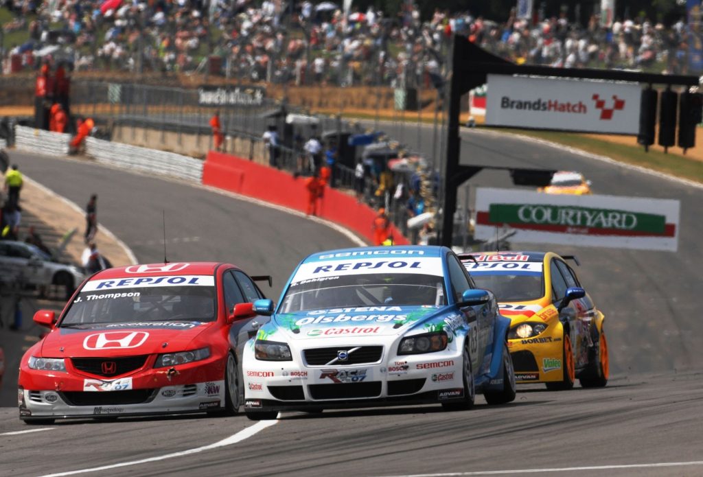 Volvo C30 touring car racing alongside a Honda Accord and SEAT Leon at Brands Hatch